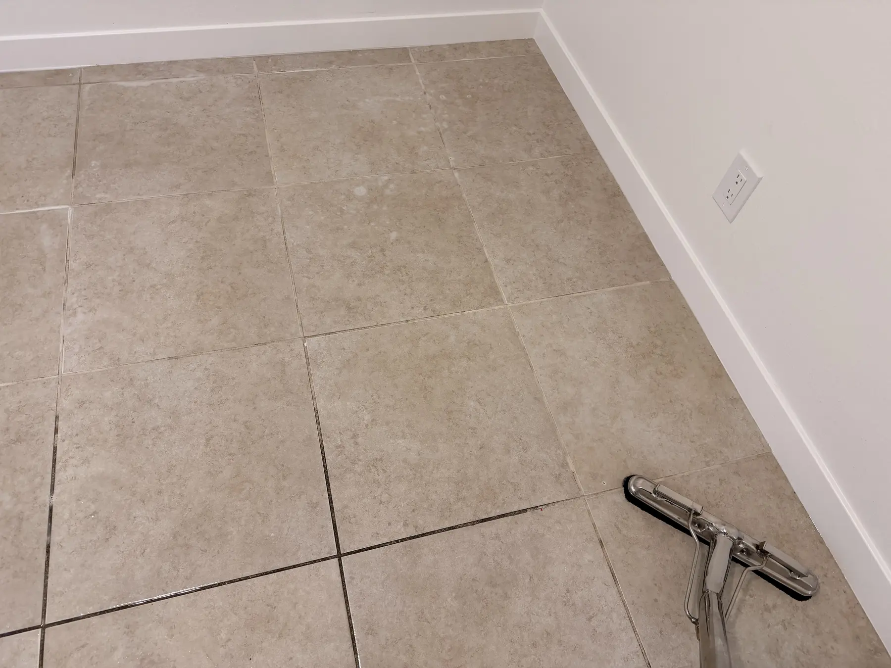 Professional hard-surface tool cleaning tile and grout lines